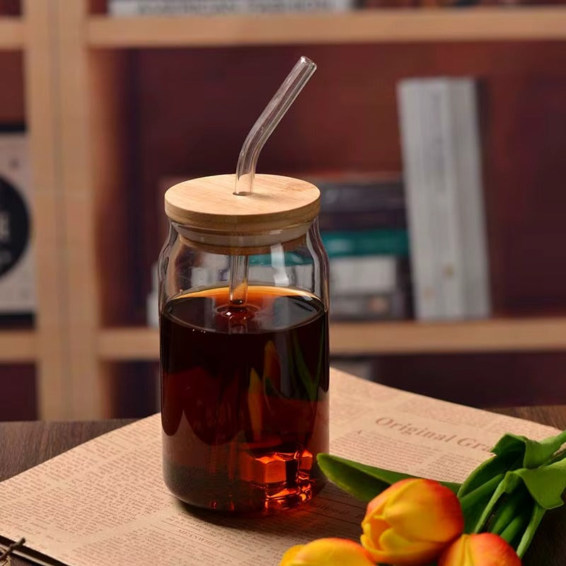360ml borosilicate glass cup with glass straw, shown holding a colourful smoothie.