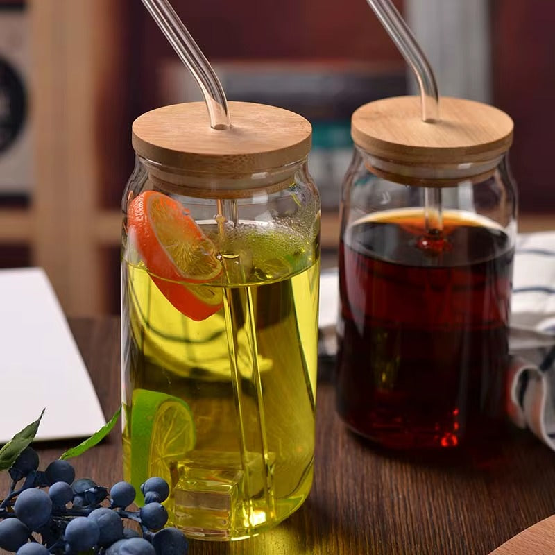 The 360ml borosilicate cup shown alongside its separate bamboo lid and glass straw.