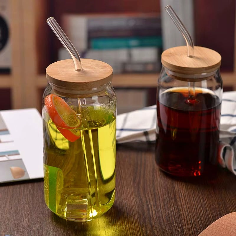 360ml glass cup with bamboo lid and straw shown on a work desk.