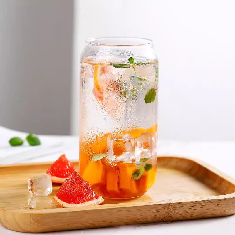 Hand holding the 360ml premium borosilicate glass tumbler.